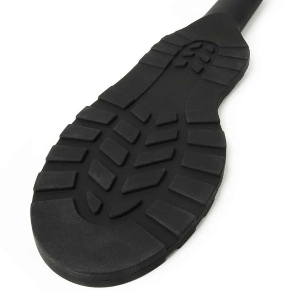 Paddle noire texturée avec poignée ergonomique et surface structurée, accessoire BDSM proposé par Brigade Mondaine Paris.