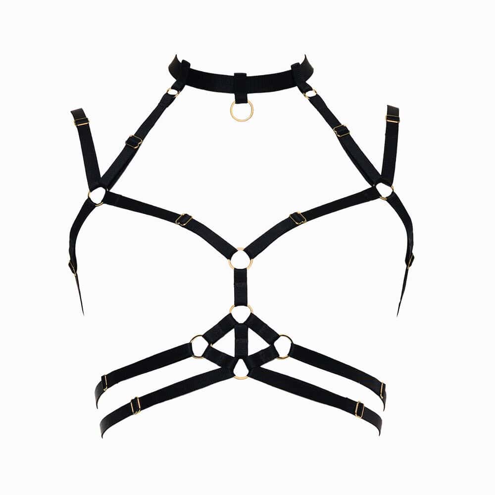 Harnais bondage Moon FLASH en sangles noires avec anneaux dorés, vue à plat sur fond blanc, design graphique et ajustable - Brigade Mondaine Paris