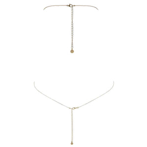 Bijou de corps en or fait à la main avec étoiles filantes pendant et croisé entre les seins FUNGI chez Brigade Mondaine