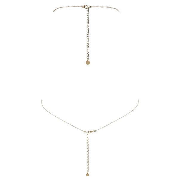 Bijou de corps en or fait à la main avec étoiles filantes pendant et croisé entre les seins FUNGI chez Brigade Mondaine
