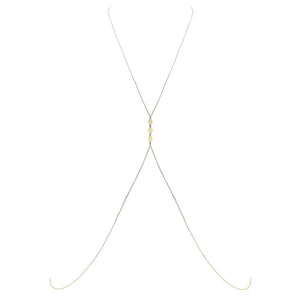 Bijou de corps en or dos nu avec petits ronds plats en or entre les seins FUNGI chez Brigade Mondaine