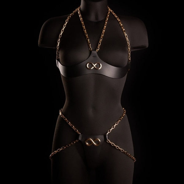 Culotte ouverte ARIA IINFYNII en cuir noir avec chaînes dorées et symbole infini, pièce graphique et structurée, sélection Brigade Mondaine Paris