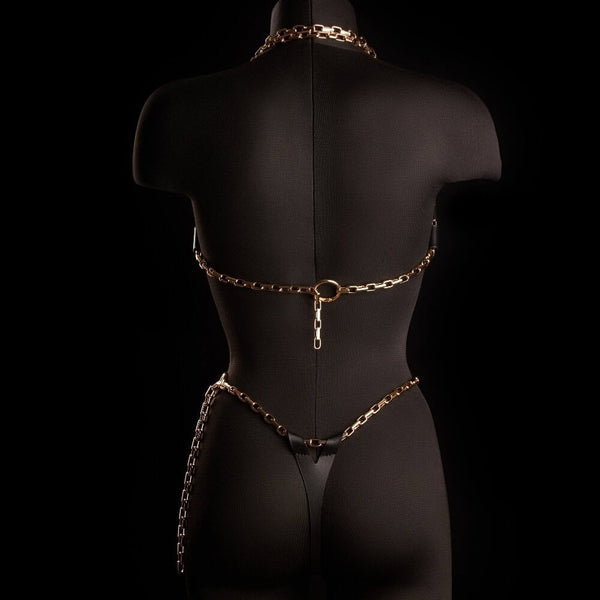 Soutien-gorge cage ARIA IINFYNII noir avec structure graphique et chaînes métalliques porté sur top en mesh, pièce lingerie design chez Brigade Mondaine Paris