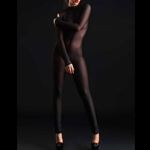 Mannequin portant le catsuit Sweety en mesh noir CATANZARO chez Brigade Mondaine Paris, coupe intégrale près du corps, manches longues, transparence uniforme et finition minimaliste.