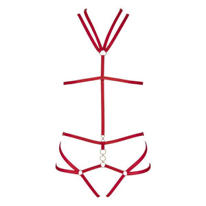 Harnais Nicole CATANZARO rouge porté sur body noir en tulle, avec sangles ajustables et anneaux métalliques, accessoire haut de gamme proposé par Brigade Mondaine.