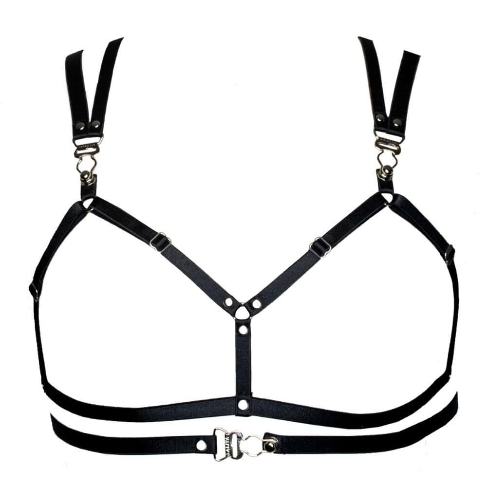 Le soutien-gorge LALITA noir offre une allure sensuelle avec son design ouvert à l'avant. Des fermetures porte-jarretelles viennent orner les bretelles et le devant, ajoutant une touche de sophistication audacieuse. Avec ses sangles ajustables, il assure à la fois un maintien parfait et un style unique, alliant sensualité et raffinement.