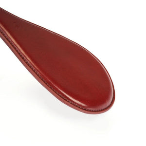 Détail du Packshot d'un Paddle Ovale en Cuir Rouge