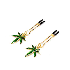 Pinces à tétons U-shape dorées avec charms feuille de cannabis émaillée et embouts noirs