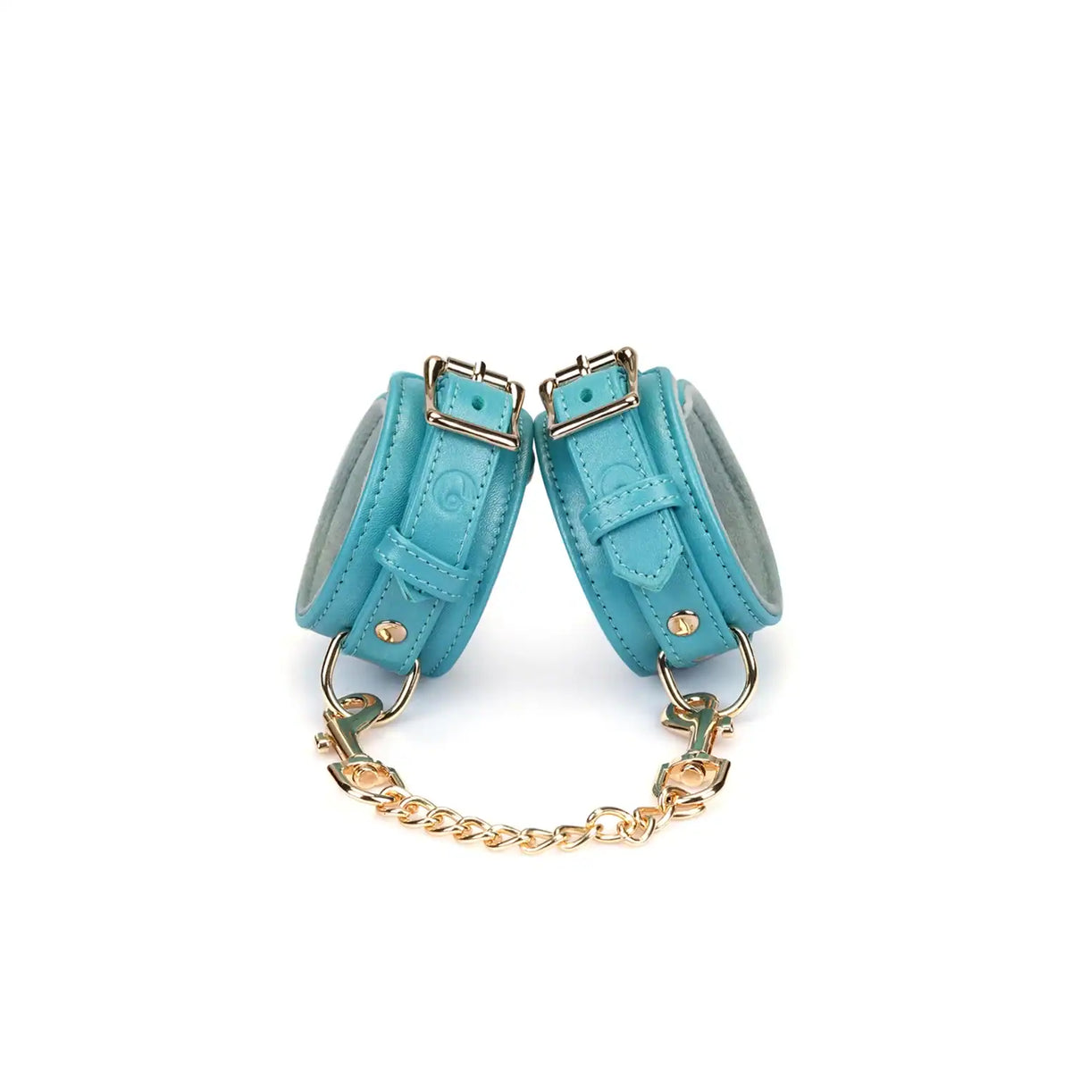 Menottes Agneau Bleu LIEBE SEELE en cuir bleu doublé agneau clair avec fermeture réglable, anneaux métalliques et chaîne dorée, photographiées sur fond blanc
