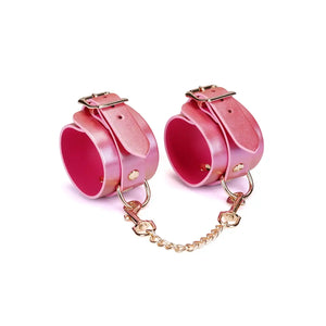 Menottes de poignet en cuir rose irisé avec boucles dorées et chaîne amovible Lustre Rosa