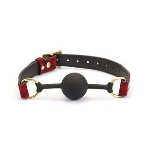 Gag BDSM Kinbaku Ukiyo-e avec touches dorées, conçu en silicone alimentaire pour un confort optimal. Sangles ajustables, lavable et imperméable. Fusion de style et de fonctionnalité pour une expérience unique.