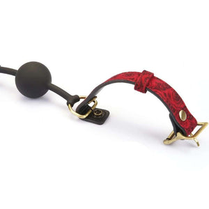 Gag BDSM Kinbaku Ukiyo-e avec touches dorées, conçu en silicone alimentaire pour un confort optimal. Sangles ajustables, lavable et imperméable. Fusion de style et de fonctionnalité pour une expérience unique.