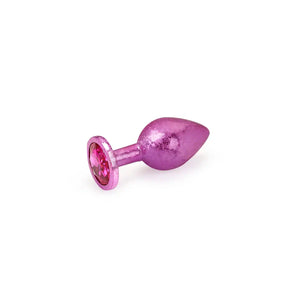 Plug anal en aluminium LIEBE SEELE coloris rose avec base évasée ornée d’une pierre, présenté sur fond blanc