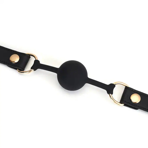 Bâillon Boule GAG en Cuir noir lisse avec boule en silicone sangle réglable détail en métal Doré