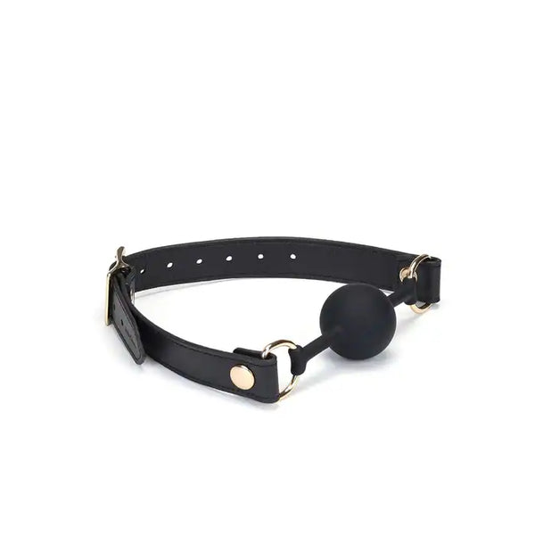 Bâillon Boule GAG en Cuir noir lisse avec boule en silicone sangle réglable détail en métal Doré