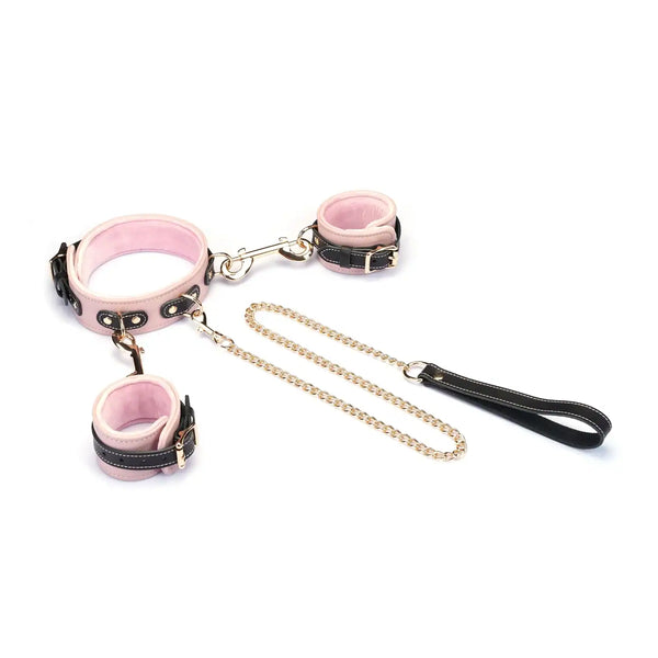 Set collier et menottes LIEBE SEELE en cuir de vache italien rose pâle, noir et doré, reliés par une chaîne dorée. Confort optimal pour les jeux de soumission élégants et raffinés.
