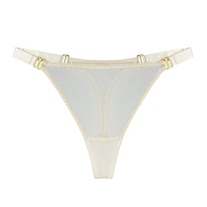 String BORDELLE Mesh Cream porté en vue rapprochée, en tulle ivoire transparent avec ceinture elastique fine et finitions métalliques dorées, présenté chez Brigade Mondaine Paris.