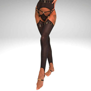Jambières QRUCIFIX en mesh noir avec harnais intégré, sangles réglables et détails métalliques dorés, portées sur fond clair et présentées par Brigade Mondaine Paris.