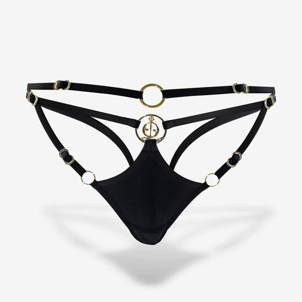 String QRUCIFIX noir à lanières fines avec anneaux métalliques dorés et design ouvert, présenté sur fond blanc par Brigade Mondaine Paris.