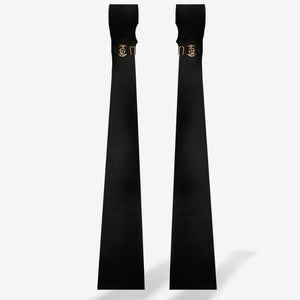 Paire de manchettes longues QRUCIFIX noires avec finitions métalliques dorées et lignes épurées, présentées sur fond blanc par Brigade Mondaine Paris.