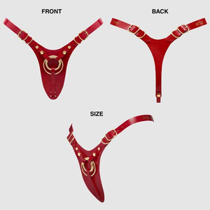 Harnais de pegging STRAP-ON-ME en cuir rouge avec anneau central doré et sangles réglables, sélection Brigade Mondaine Paris.