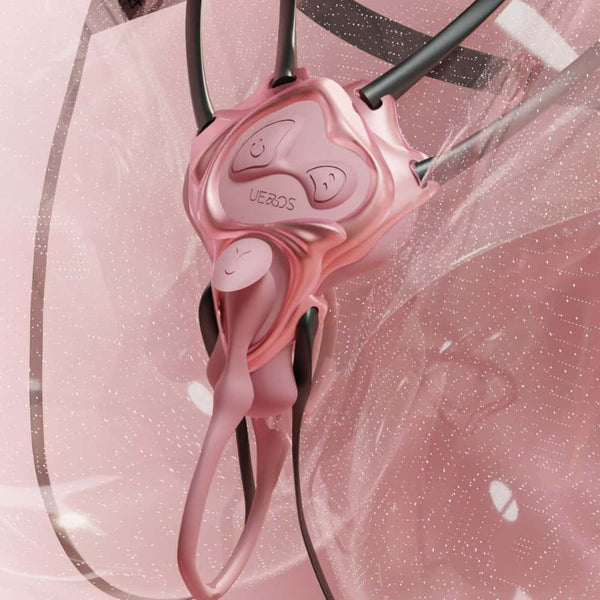 Vue détaillée d’un vibromasseur UEROS rose, montrant les boutons de contrôle et la forme ergonomique, sur fond graphique rosé.