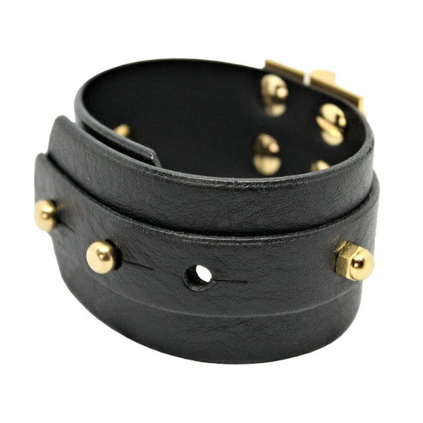 Packshot sur fond blanc du bracelet Twin Strap Hinge en cuir noir.