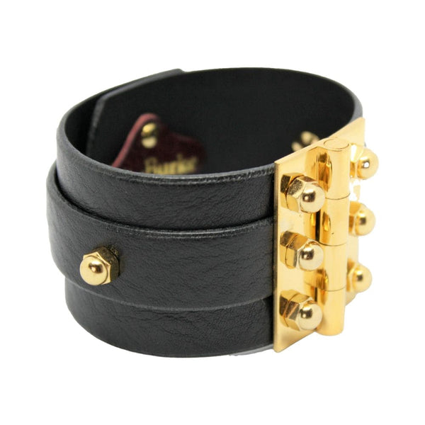 Packshot sur fond blanc du bracelet Twin Strap Hinge en cuir noir.