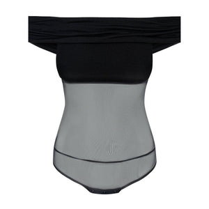 Body noir Undress Code Libra à épaules dégagées, porté par un modèle tenant une coupe de champagne, sélection Brigade Mondaine Paris.