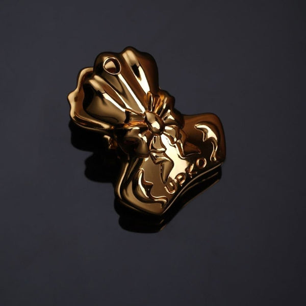Pinces à Tétons Nœud papillon Dorées Ornées d’un motif en relief délicat