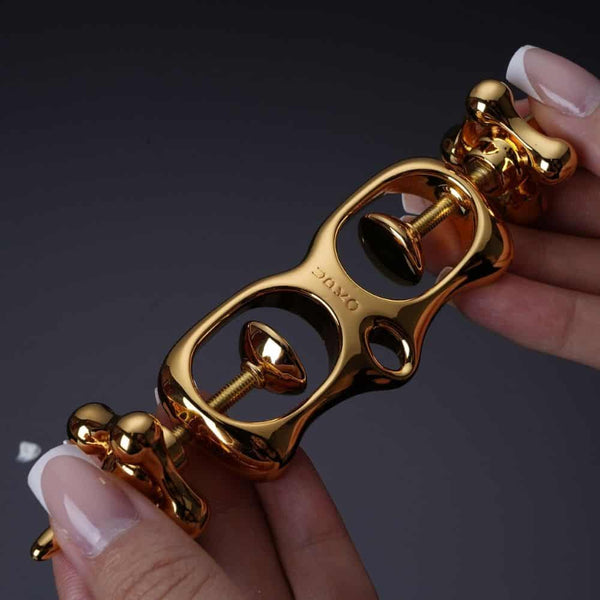 Menottes BDSM Pour Pouces mécanisme à vis progressif Finitions Dorées