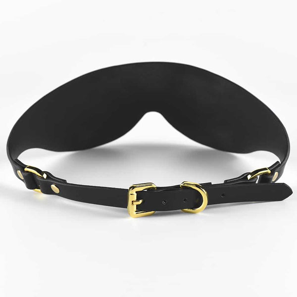 Masque cache-yeux tout en cuir noir et finition or UPKO chez Brigade Mondaine
