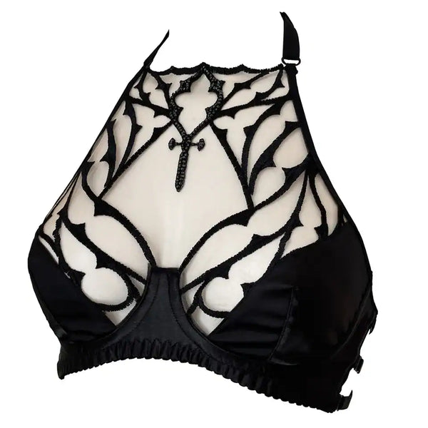 Soutien-gorge gothique en tulle nude brodé noir avec perles facettées. Demi-bonnets en satin noir doublé et col licou réglable. Élégance dramatique et maintien confortable.