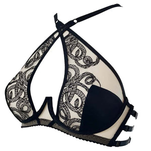 Soutien-gorge Aspidis VIDE NOIR présenté chez Brigade Mondaine Paris, mesh nude brodé de motifs noirs serpentins, bonnets structurés, bretelles fines et fermeture réglable, photographié en studio.