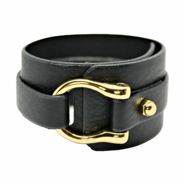 Packshot on white background of Una Burke's black leather wide D stacking cuff.