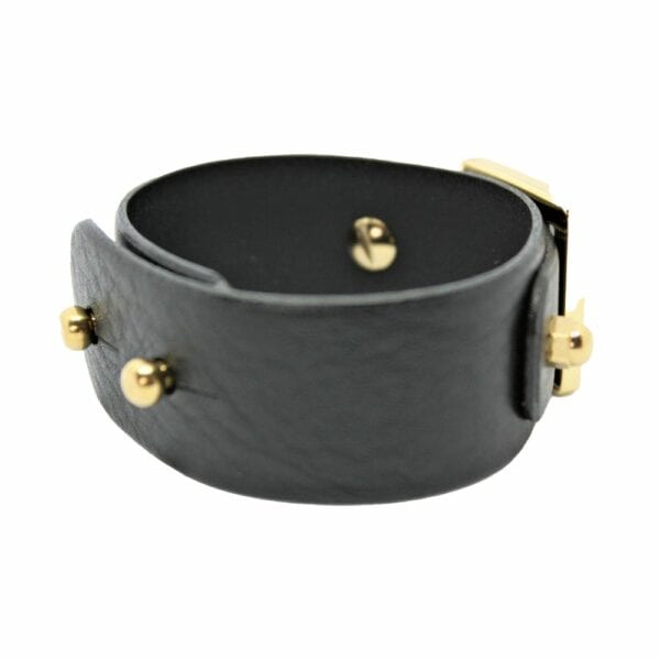 Packshot sur fond blanc de la menotte wide D stacking en cuir noir de Una Burke.