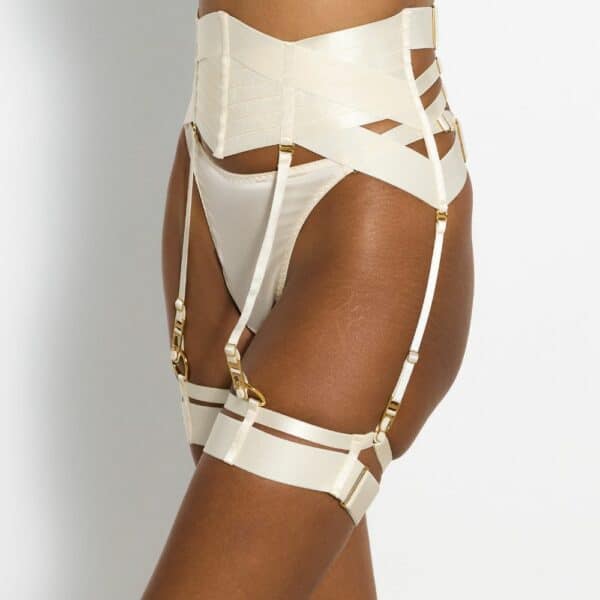 Detail of Photo of 3/4-Size Woman Wearing Cream Silk Bustier Bra, Garter Belt, Garters and G-string