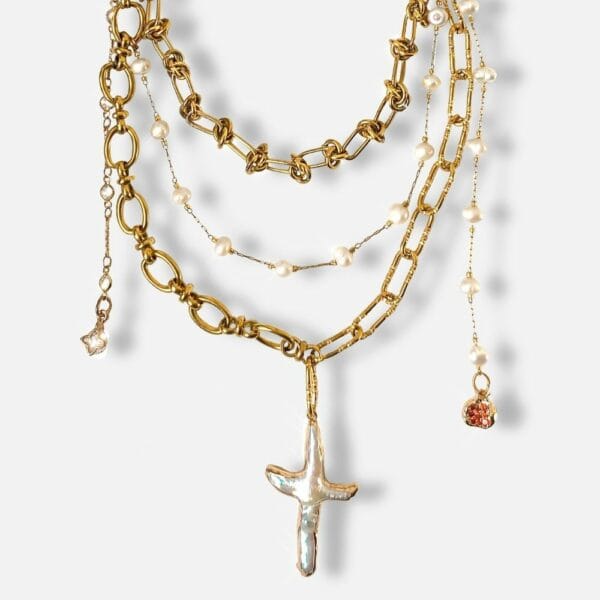 Packshot of a Gold Chain Necklace with Pearls and Charms