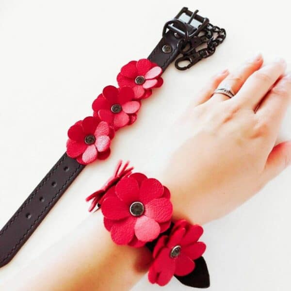 Photos of Black Leather Handcuffs with Red Leather Flowers and Black Chain on one wrist