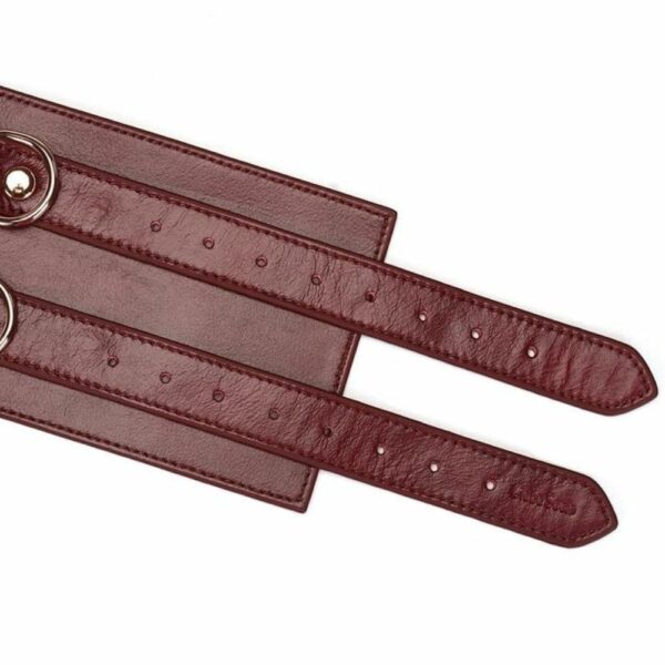 Detail of the Packshot of the Front of a Red Lay Flat Leather Belt