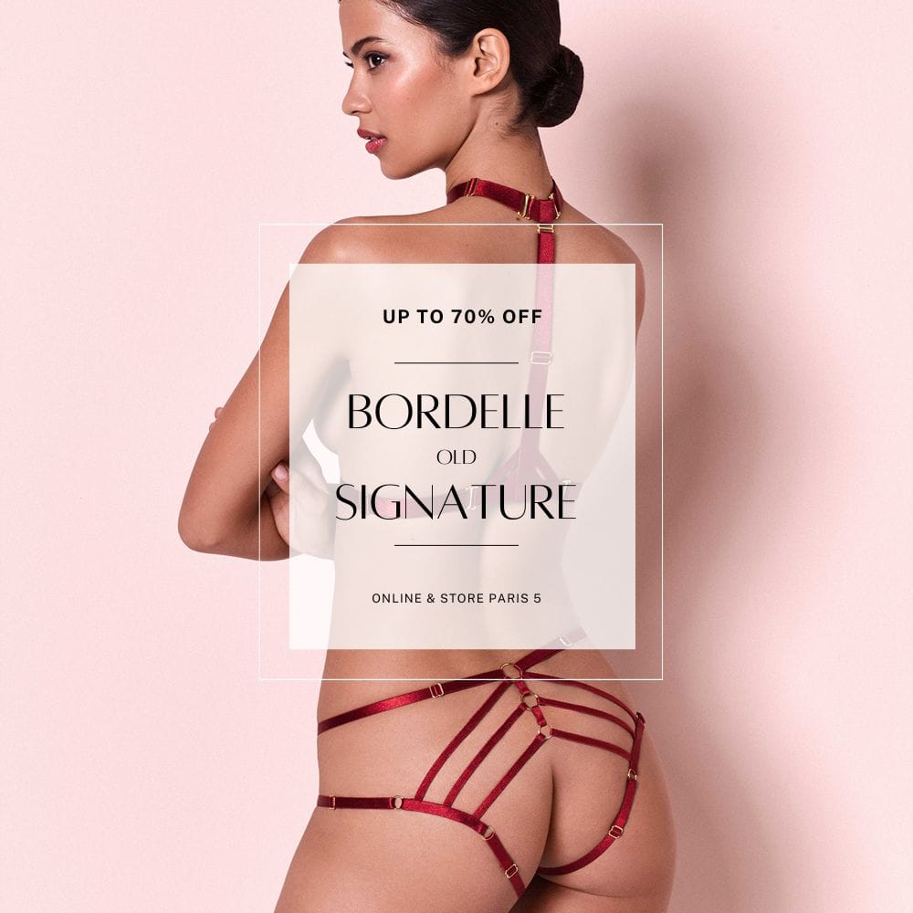 Promotional Photo for Discounts Bordelle of a Woman from the Back Wearing a Harness and Open Panties Color Red