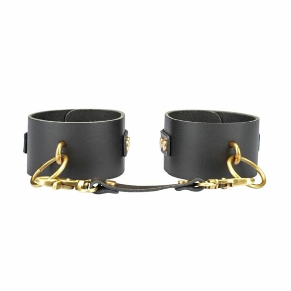 Black Leather Handcuff Front Packshot with Gold Rings and Black Leather Link with Gold Carabiners