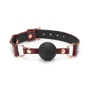 Packshot Baillon GAG En Cuir de Vache Rouge et Détail Rose Gold Boule en Silicone Noir