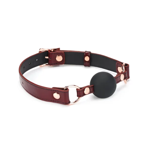 Packshot Baillon GAG En Cuir de Vache Rouge et Détail Rose Gold Boule en Silicone Noir