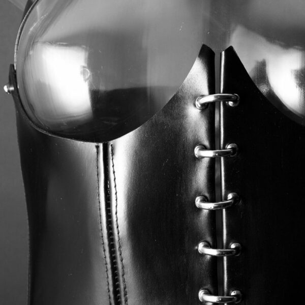 Detail of the Front of an Open Corset in Black Leather