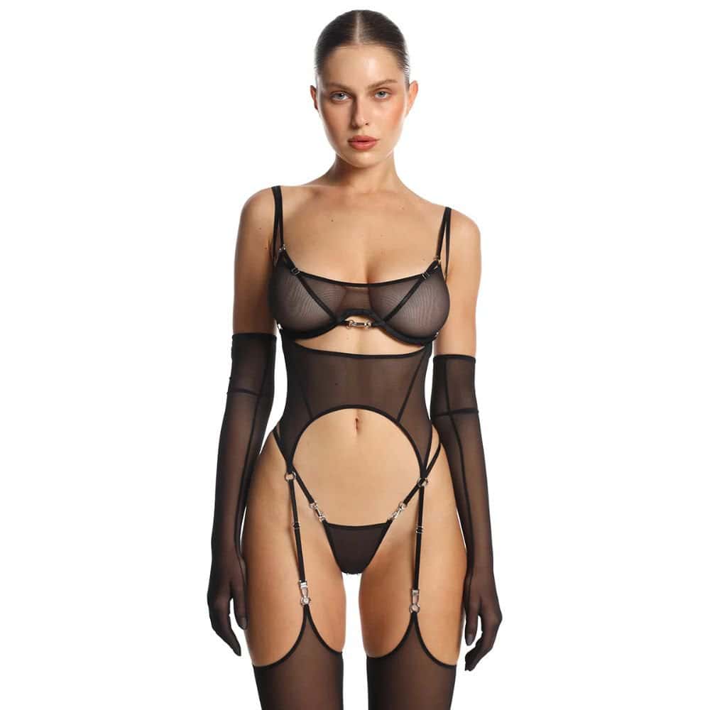 Woman Wearing A Black Semi-Transparent Mesh Bra, G-string and Suspender Belt Set With Matching Mesh Stockings