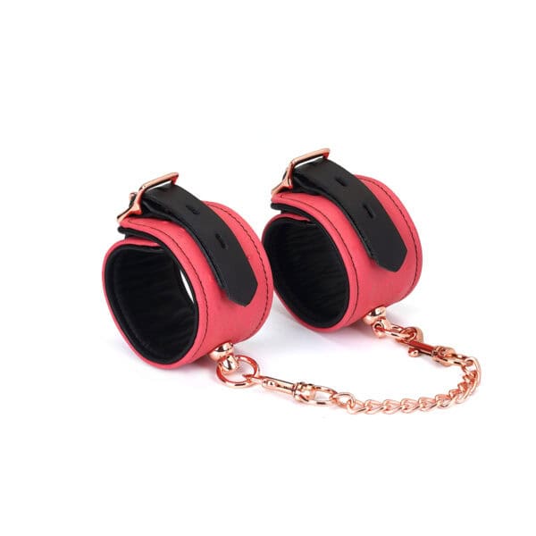 Packshot Pink and Black Leather Handcuffs with Pink Gold Chain Attachment